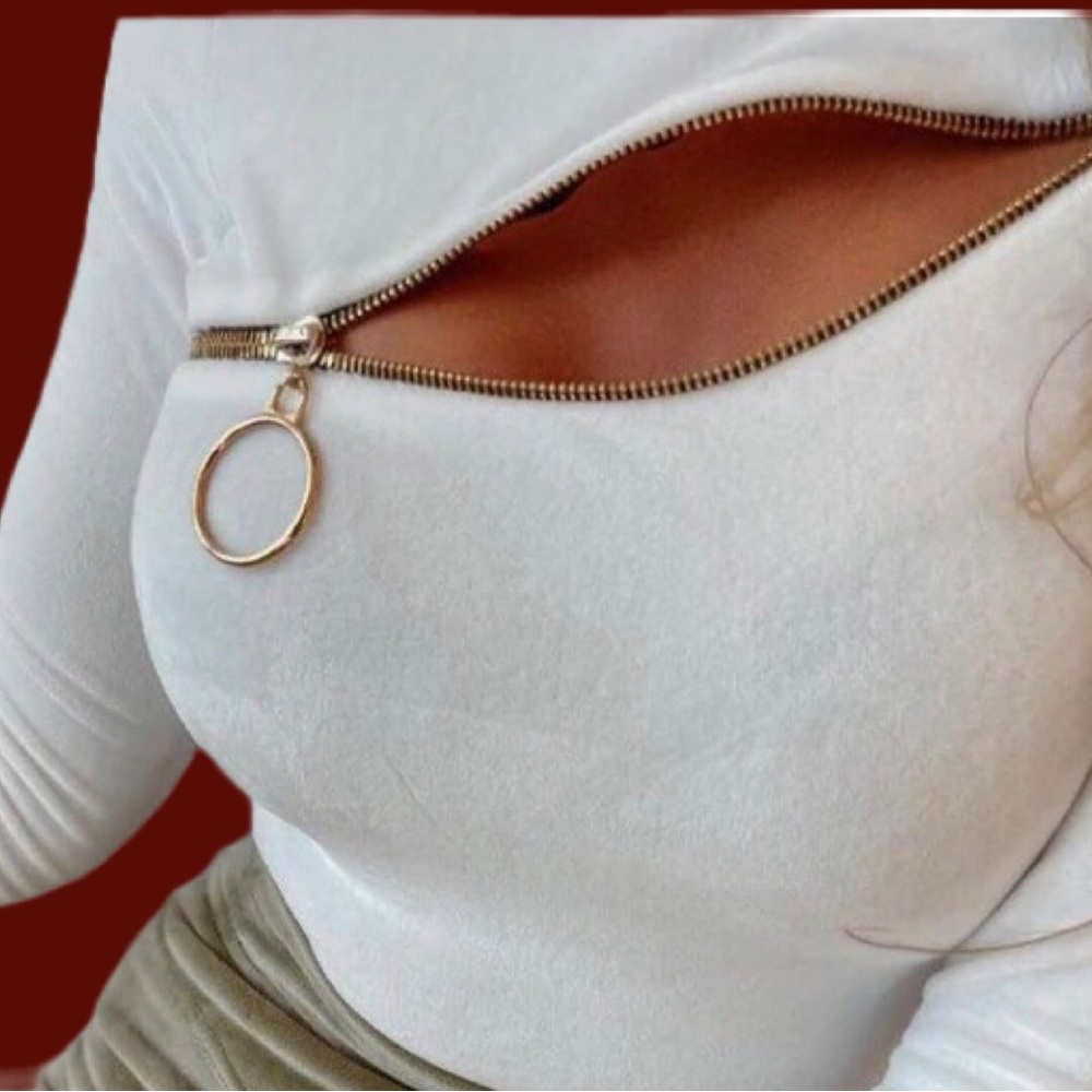 Long sleeve white shirt with front zipper. Size small. New item